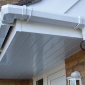 sutton-porch-with-white-upvc-fascias-cladding-gutter-drainpipe-detail-1030x772